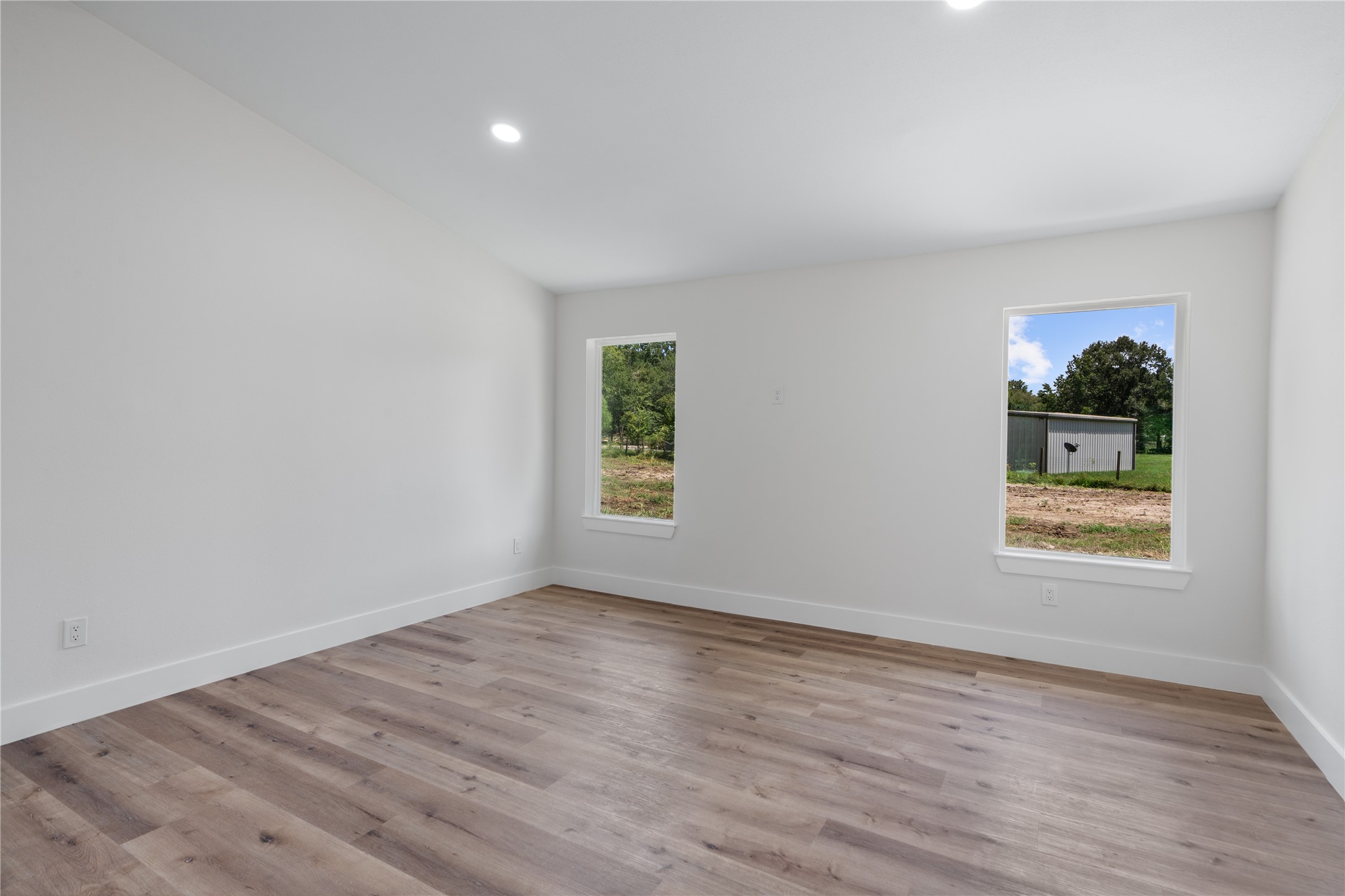 12019 Beth Lane Magnolia, TX 77354 - Photo 14 of 49 an empty room with wooden floor and window