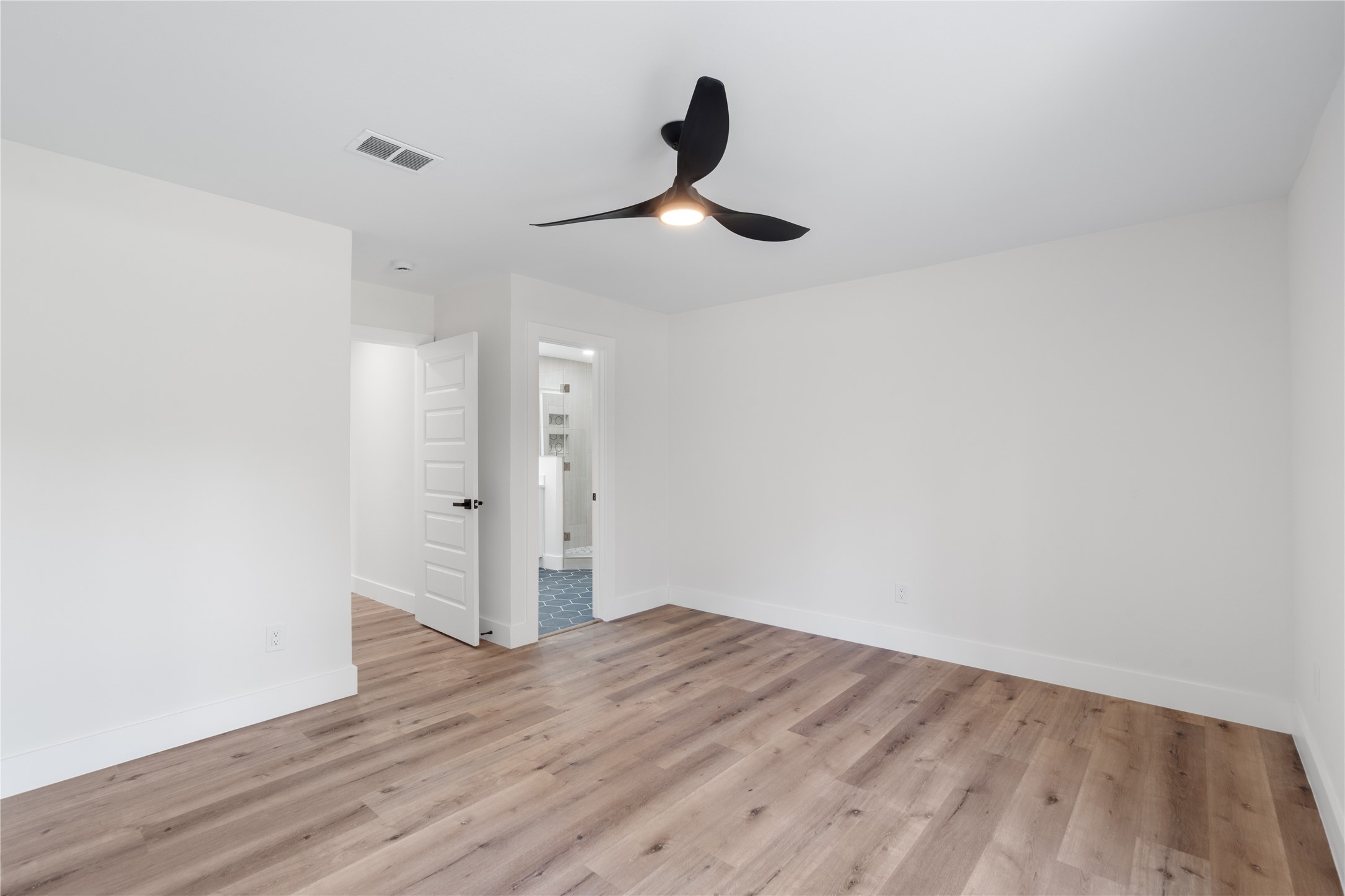 12019 Beth Lane Magnolia, TX 77354 - Photo 17 of 49 Another view of the primary retreat fit for a King size bed! NO CARPET is always a bonus.