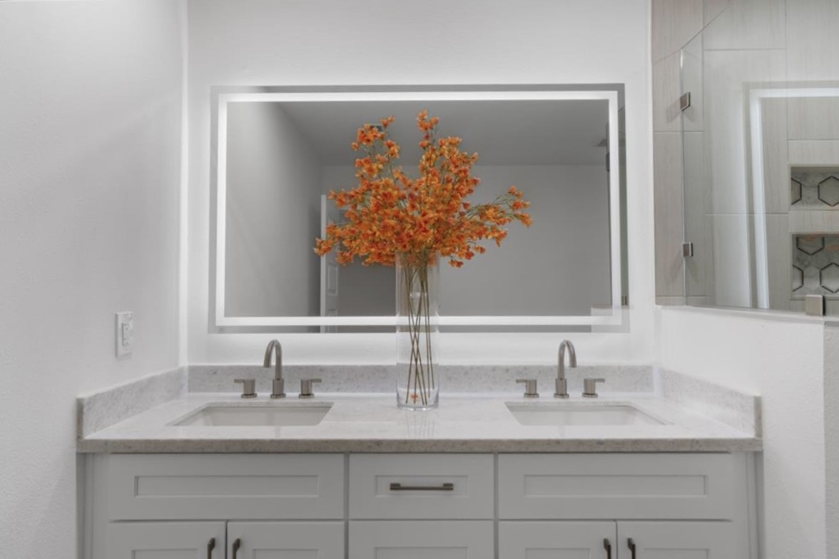 12019 Beth Lane Magnolia, TX 77354 - Photo 18 of 49 Primary Bath adorned with his and her sink, soft close drawers and cabinets for storage, quartz countertops, modern hardware, and a oversized led front and backlit mirror with steam proof feature and multiple lighting settings.