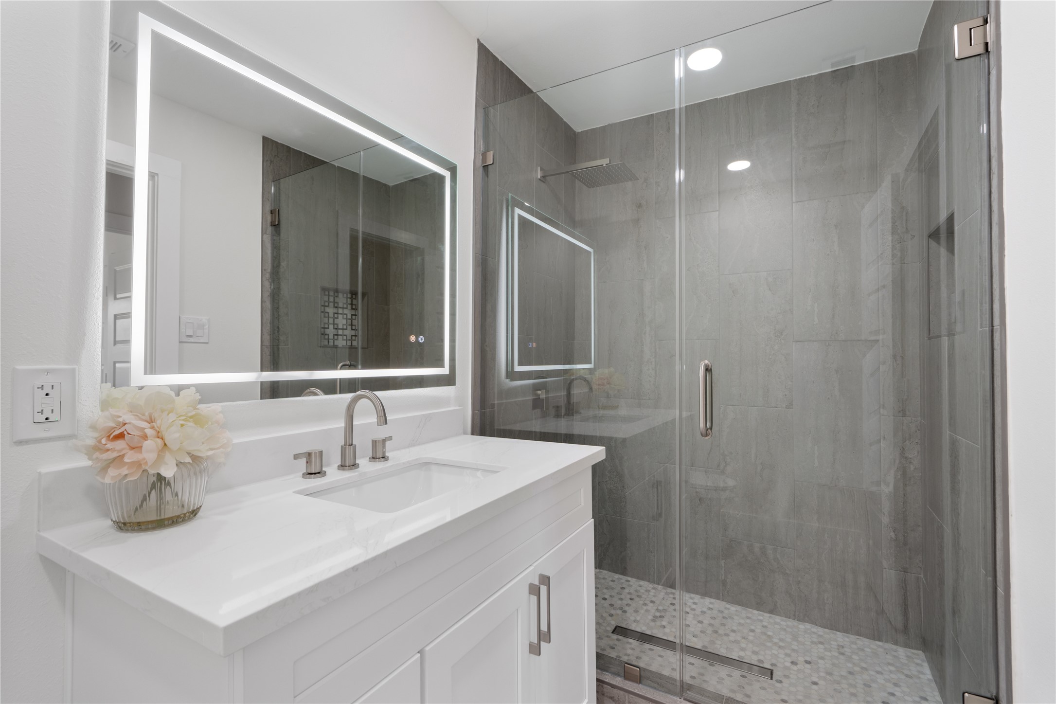 12019 Beth Lane Magnolia, TX 77354 - Photo 21 of 49 a bathroom with a sink vanity and a mirror