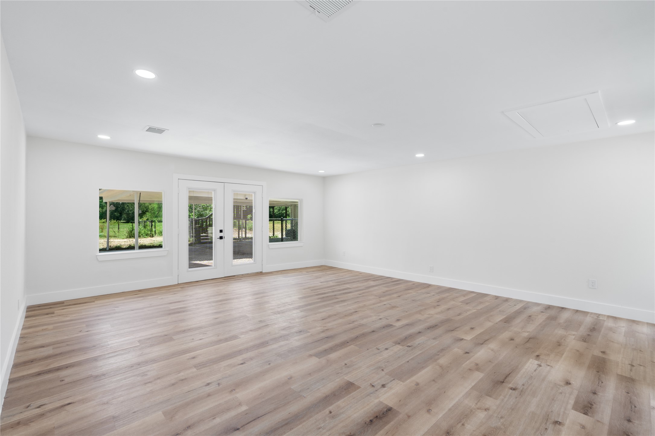12019 Beth Lane Magnolia, TX 77354 - Photo 28 of 49 a view of an empty room with a window and wooden floor