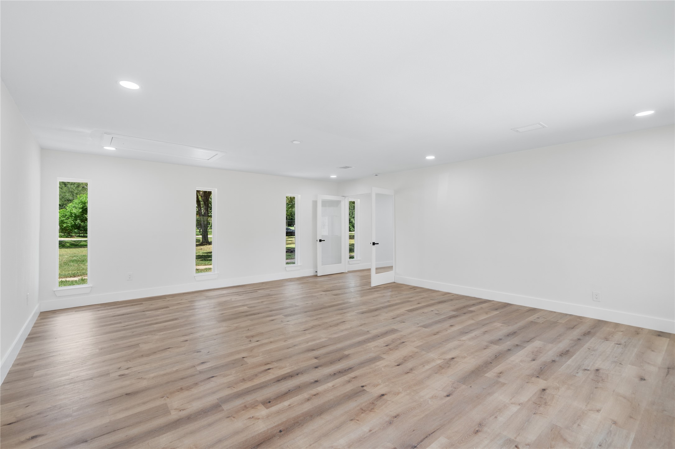12019 Beth Lane Magnolia, TX 77354 - Photo 30 of 49 a view of an empty room with wooden floor and a window