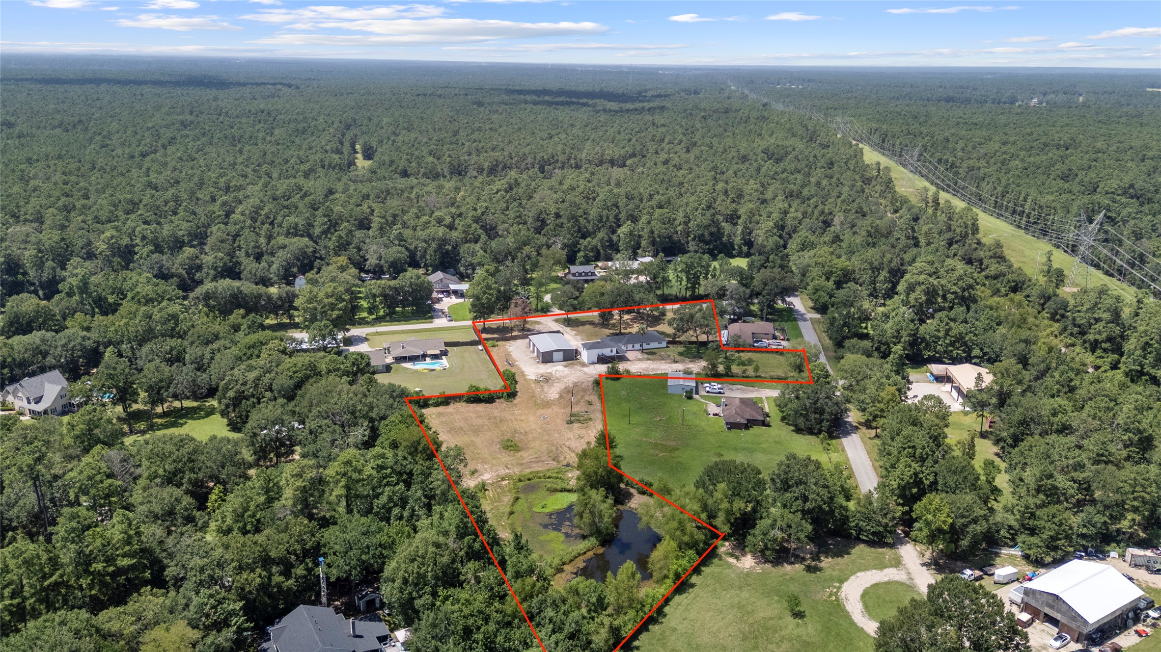 12019 Beth Lane Magnolia, TX 77354 - Photo 4 of 49 3.579 Acres with your own stocked pond, 800 sq ft apartment completly redone, and a massive workshop with own gated entrance door.