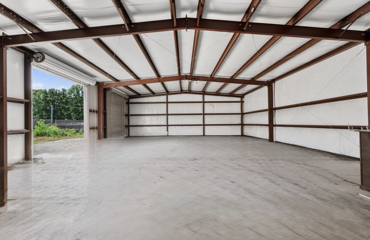 12019 Beth Lane Magnolia, TX 77354 - Photo 43 of 49 Run your business from your home or create the ultimate man cave, Fully insulated, Steel Building, 60x40, 3 (12x12) Bay Doors, Has its own seperate entrance gate.