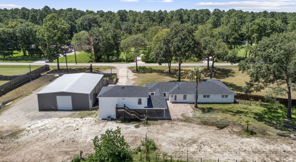 12019 Beth Lane Magnolia, TX 77354 - Photo 47 of 49 an aerial view of a house with a garden