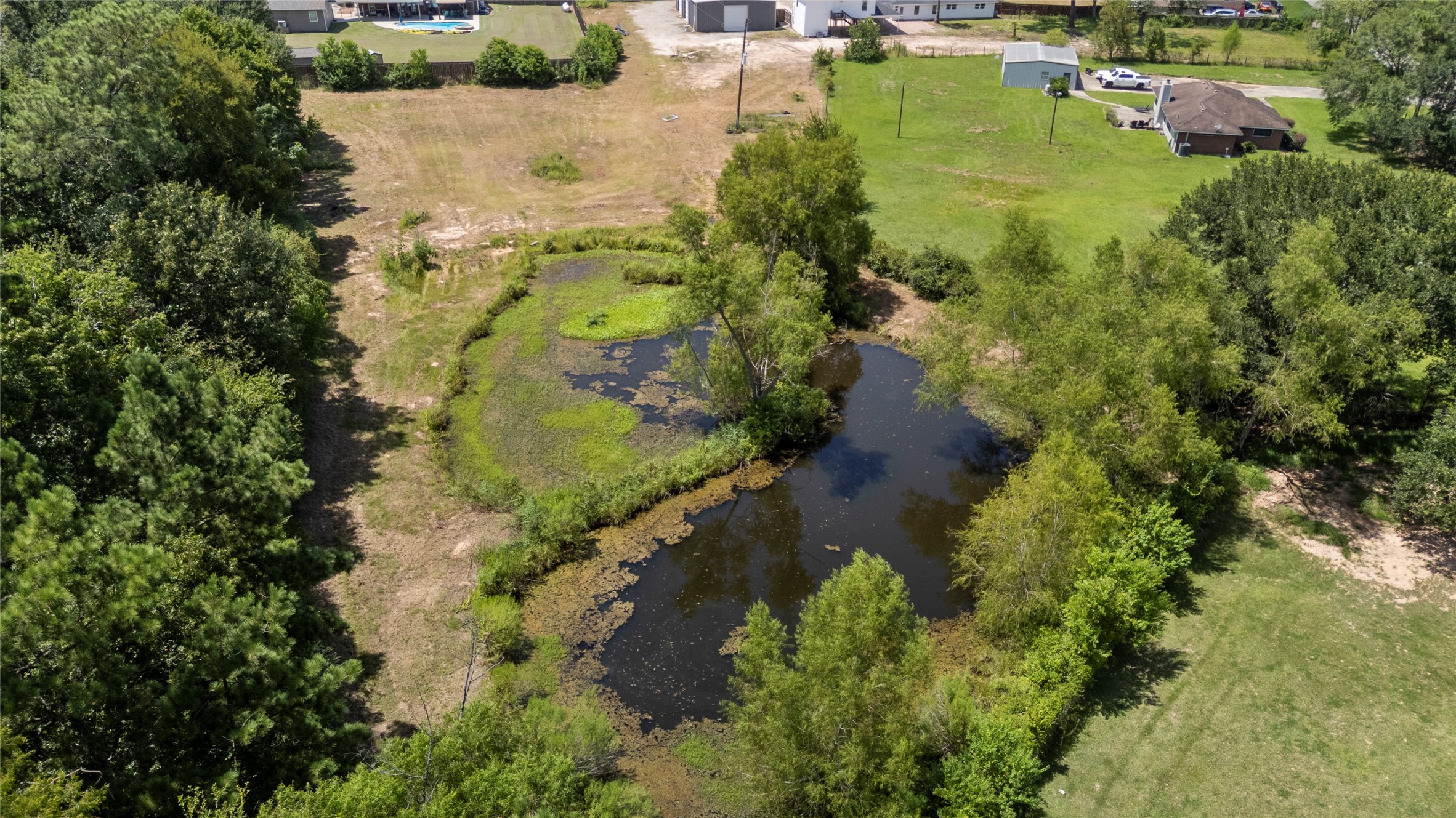 12019 Beth Lane Magnolia, TX 77354 - Photo 49 of 49 an aerial view of residential houses with outdoor space and trees all around
