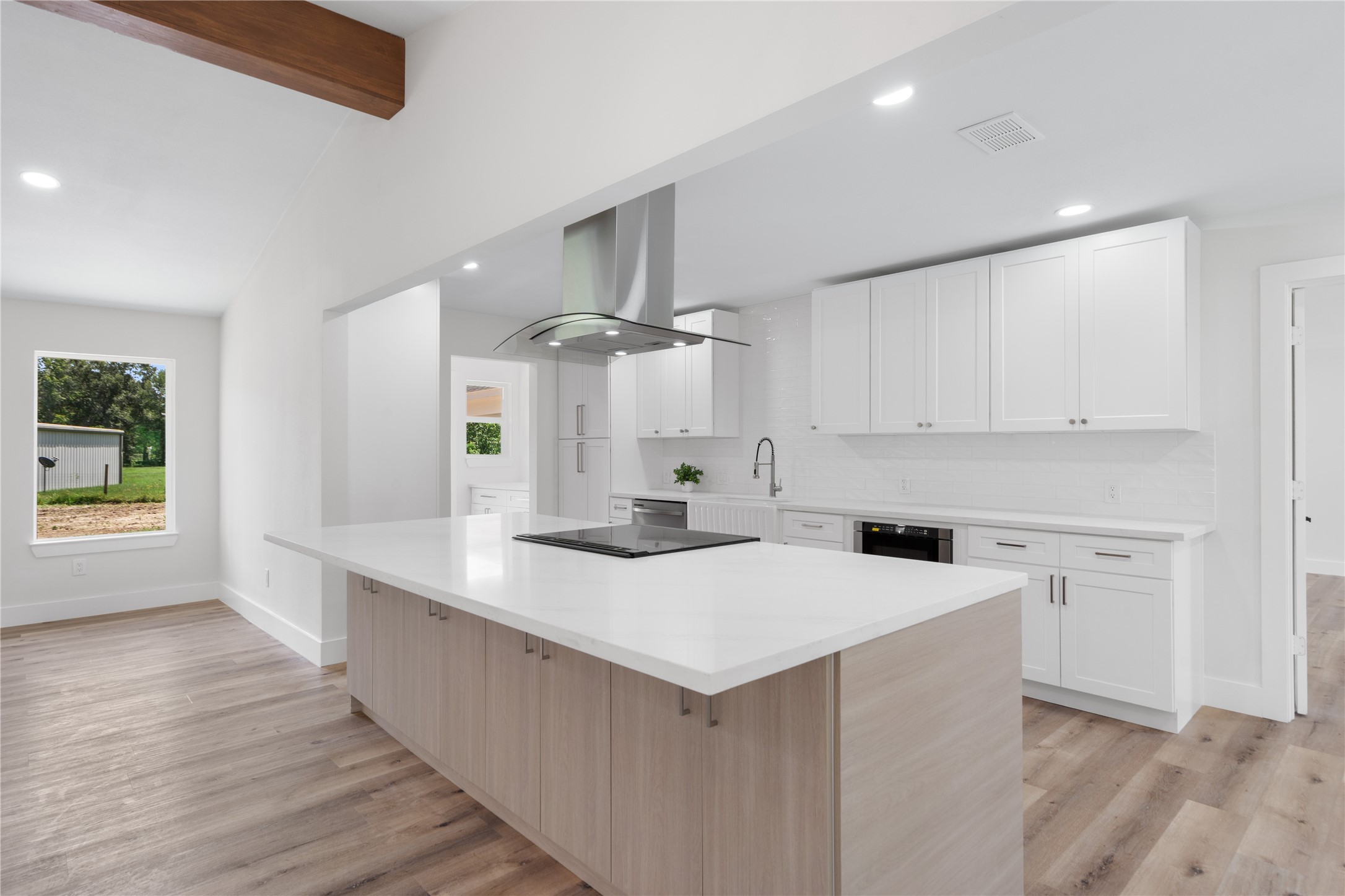 12019 Beth Lane Magnolia, TX 77354 - Photo 7 of 49 a kitchen with a sink a stove and cabinets