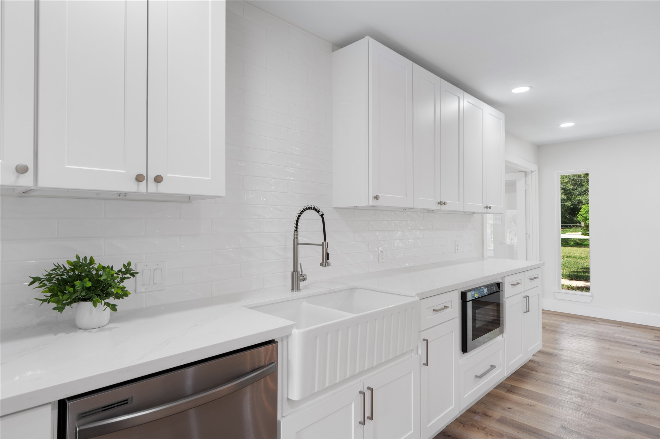12019 Beth Lane Magnolia, TX 77354 - Photo 8 of 49 a kitchen with white cabinets and white appliances