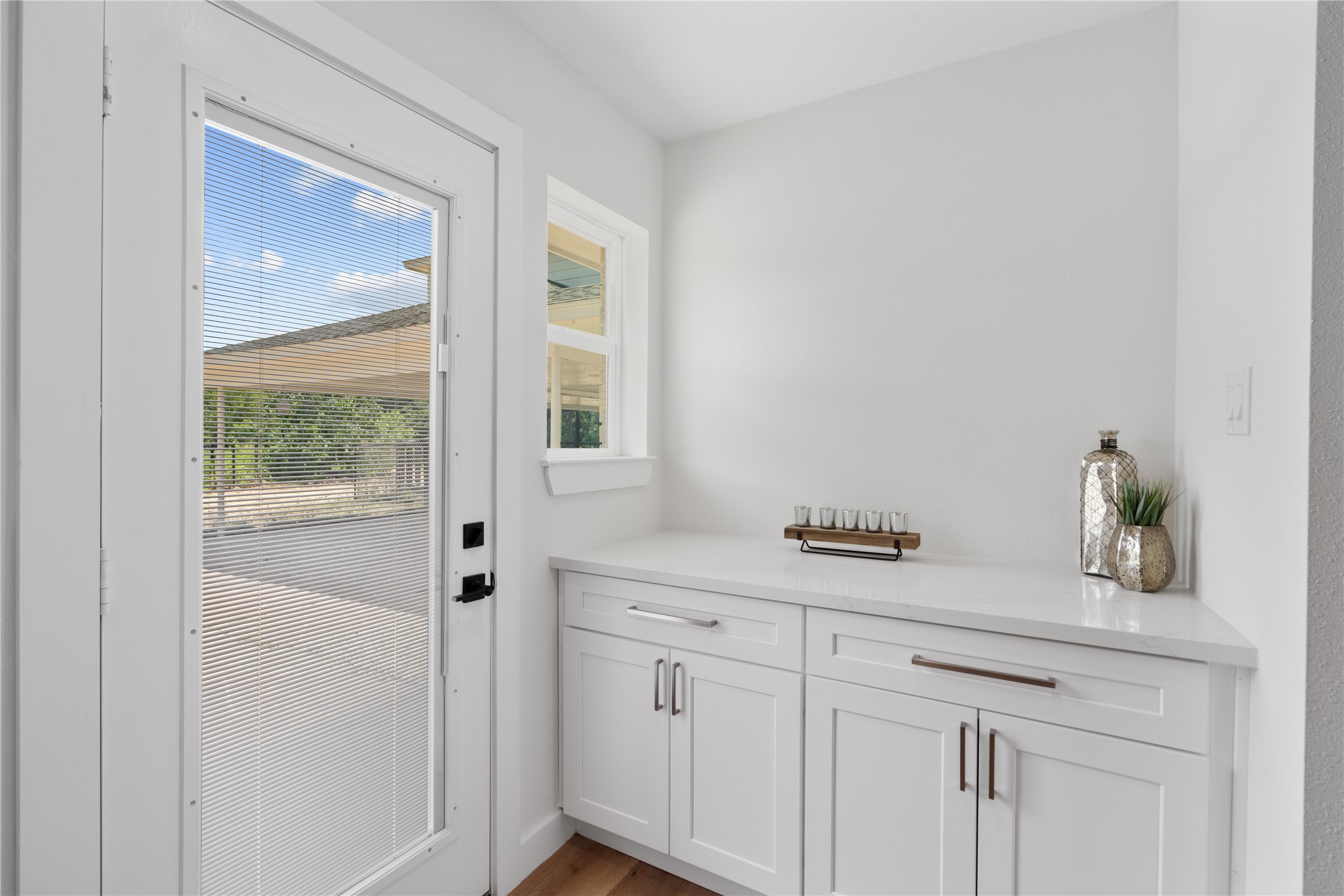 12019 Beth Lane Magnolia, TX 77354 - Photo 9 of 49 Tucked away in the back of the kitchen is the open butler pantry area with shelving on the opposite side for groceries, and additional storage, also makes a great space for a coffee bar or serving area.