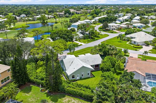 a front view of a house with a garden and deck