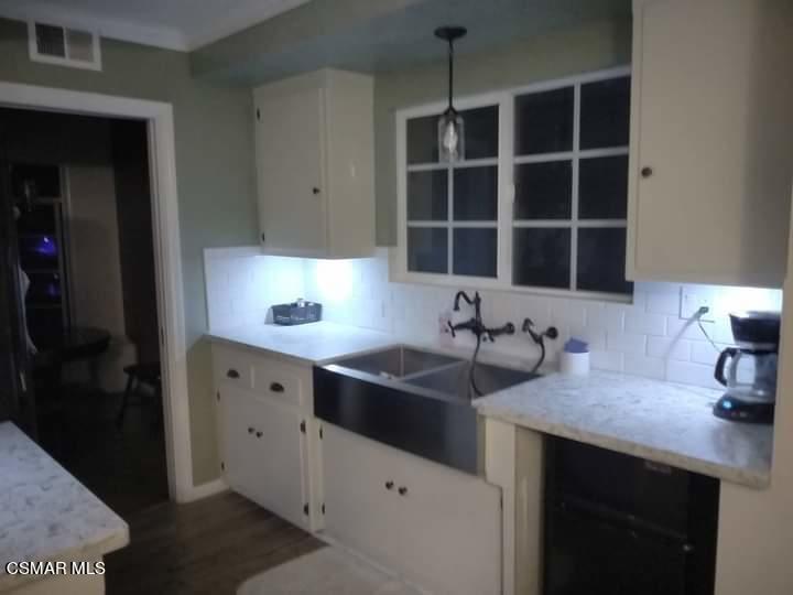 1209 West Roderick Avenue Oxnard, CA 93030 - Photo 11 of 30 a kitchen with a sink and a window