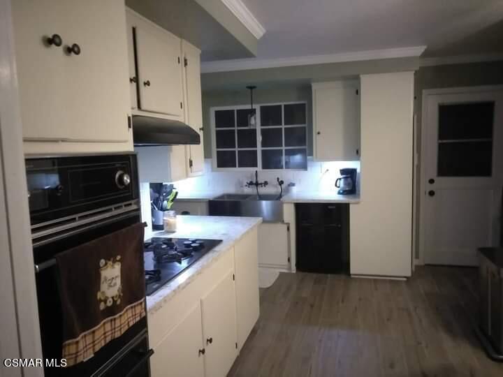 1209 West Roderick Avenue Oxnard, CA 93030 - Photo 12 of 30 a kitchen with stainless steel appliances kitchen island granite countertop a stove a sink and a refrigerator