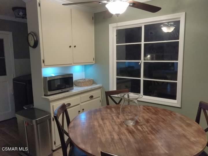 1209 West Roderick Avenue Oxnard, CA 93030 - Photo 13 of 30 a room with a chair and a flat screen tv