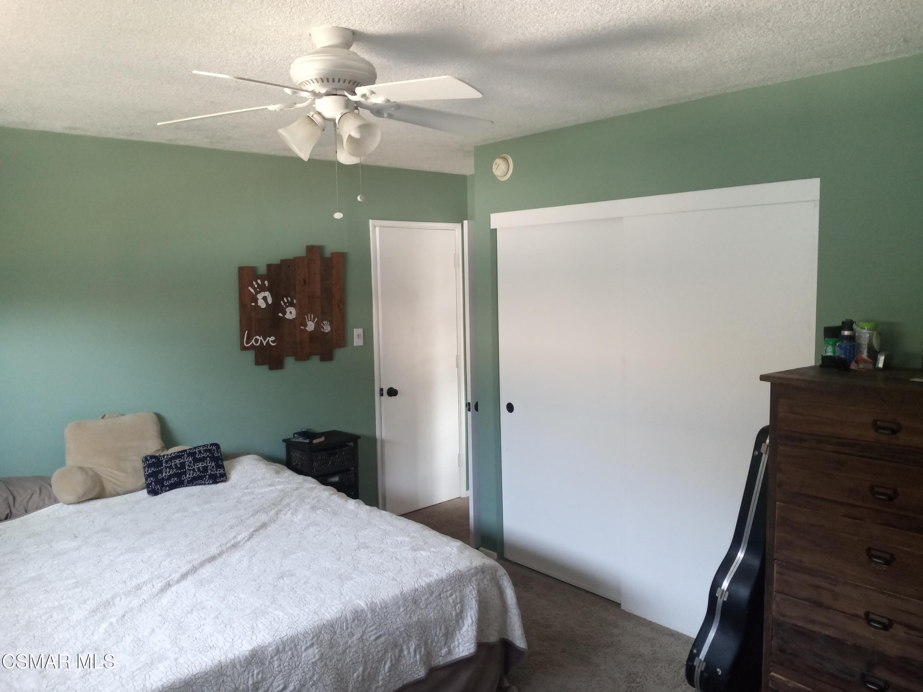 1209 West Roderick Avenue Oxnard, CA 93030 - Photo 23 of 30 a bedroom with a bed and a dresser