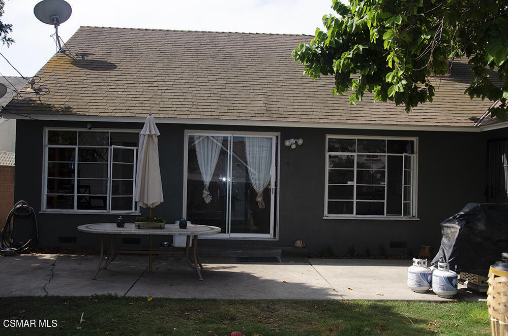 1209 West Roderick Avenue Oxnard, CA 93030 - Photo 26 of 30 a view of house with backyard outdoor seating area and furniture