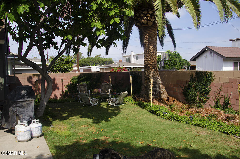 1209 West Roderick Avenue Oxnard, CA 93030 - Photo 29 of 30 a view of a house with a yard and sitting area