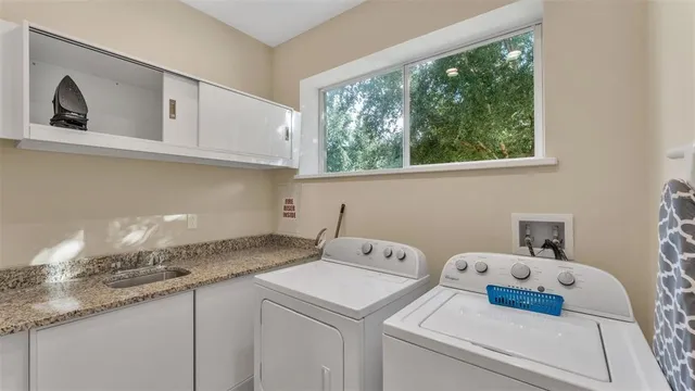 a bathroom with a shower and a sink