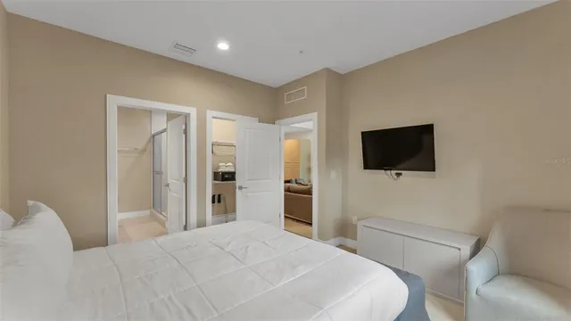 a bathroom with a granite countertop sink a toilet and a mirror