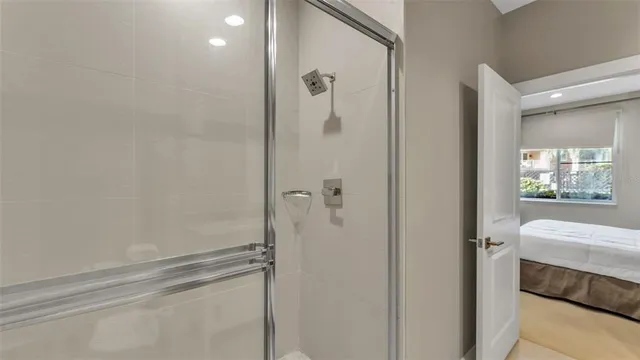 a bedroom with a bed and a lamp