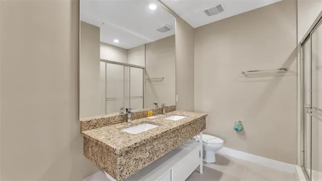 a bathroom with a shower and a shower