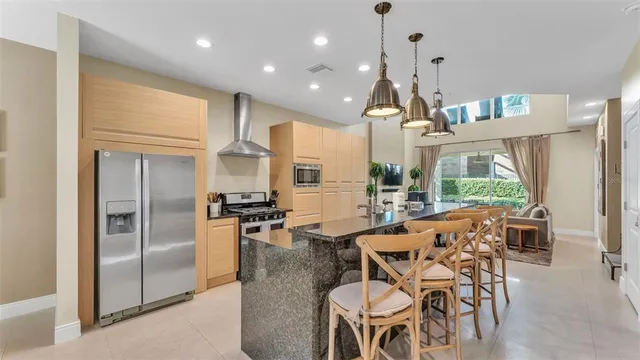 a living room with furniture a flat screen tv and a large window