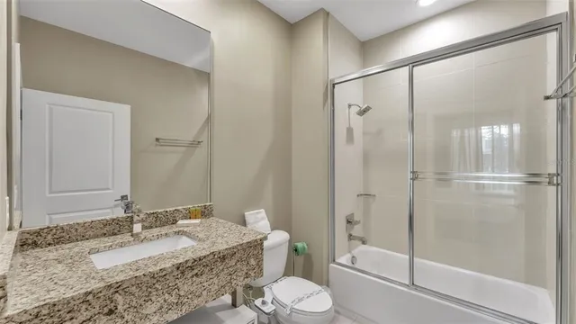 a view of a patio with table and chairs and potted plants