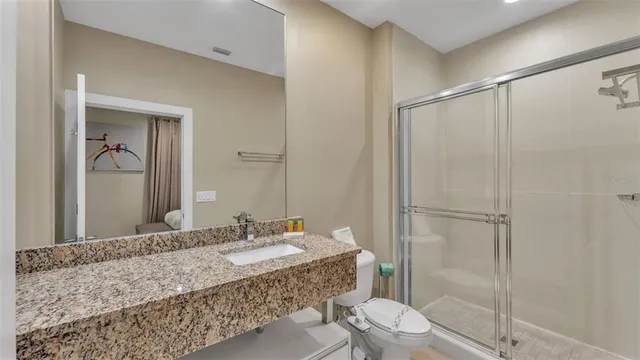 an outdoor space with lots of tables and chairs