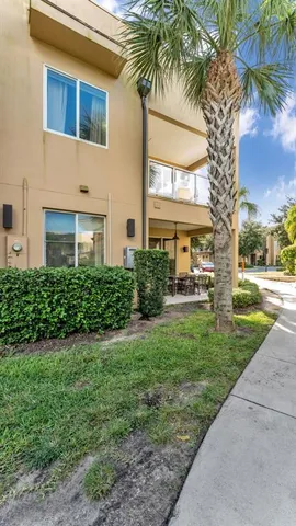 a view of a patio with table and chairs and potted plants