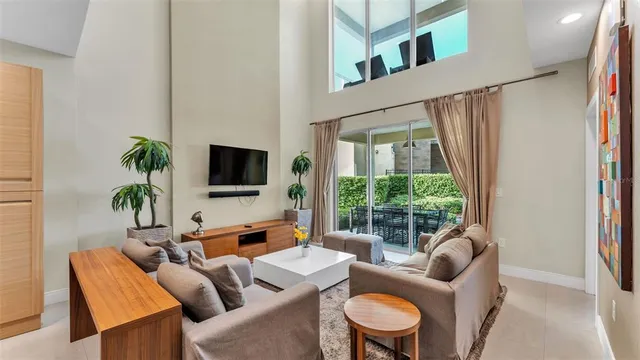 a very nice looking kitchen with many windows and furniture