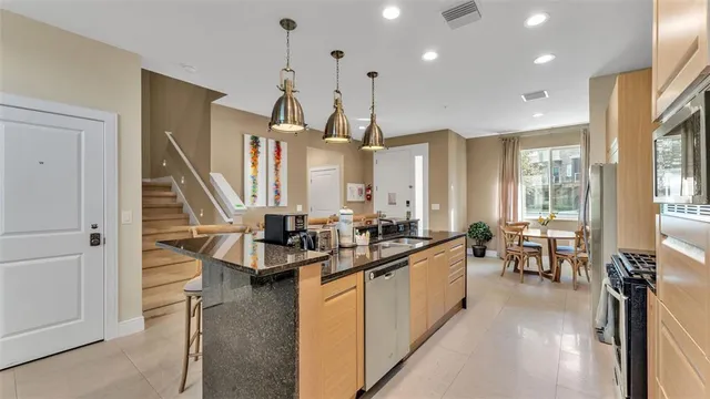 a dining room with furniture and window
