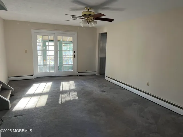 a view of empty room with windows