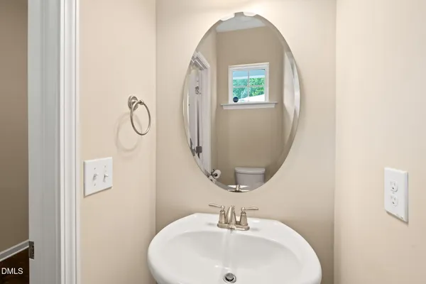 a bathroom with a sink and mirror