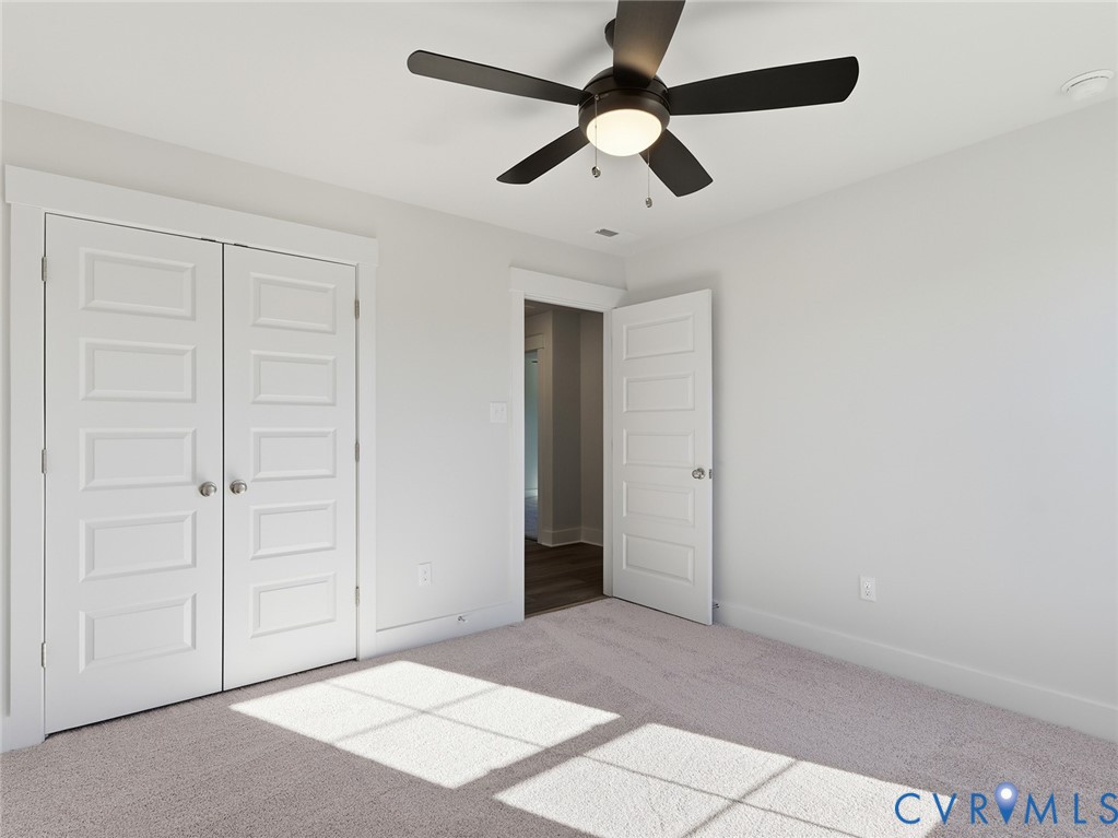 1711 Reed Marsh Lane Goochland, VA 23063 - Photo 16 of 25 an empty room with chandelier fan