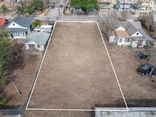 an aerial view of a house with outdoor space