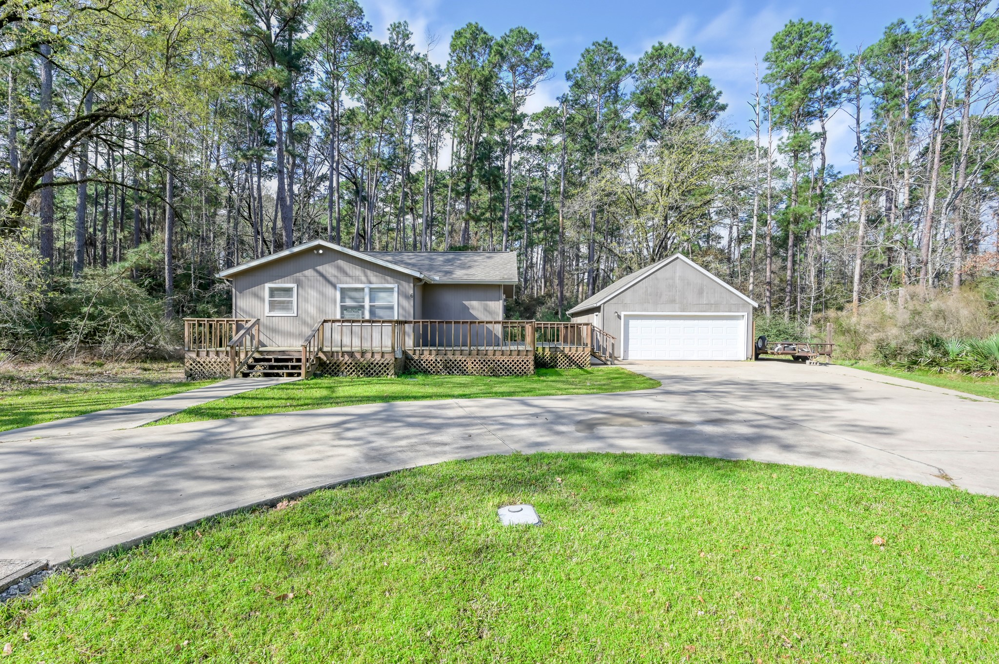 6 Hollow Forest Trinity, TX 75862 - Photo 1 of 38 a front view of a house with garden