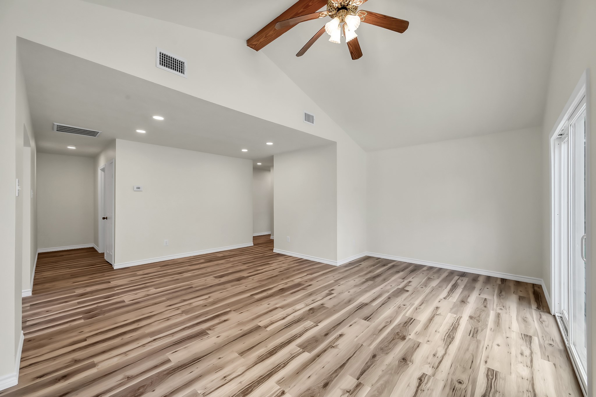 6 Hollow Forest Trinity, TX 75862 - Photo 15 of 38 wooden floor in an empty room with a window