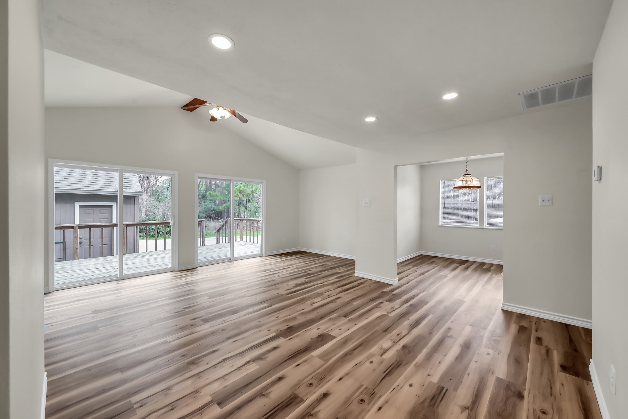 6 Hollow Forest Trinity, TX 75862 - Photo 19 of 38 a view of an empty room with wooden floor and a window