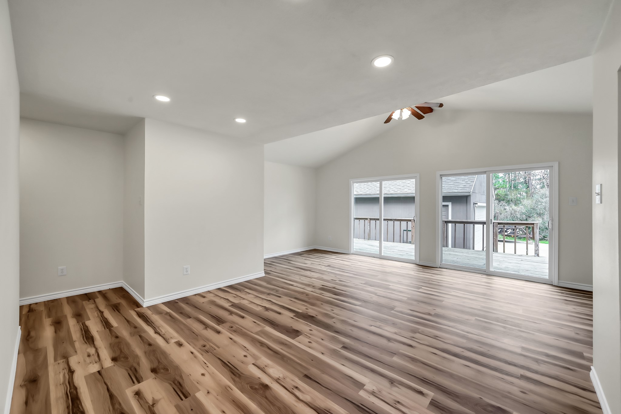 6 Hollow Forest Trinity, TX 75862 - Photo 20 of 38 a view of empty room with wooden floor and fan