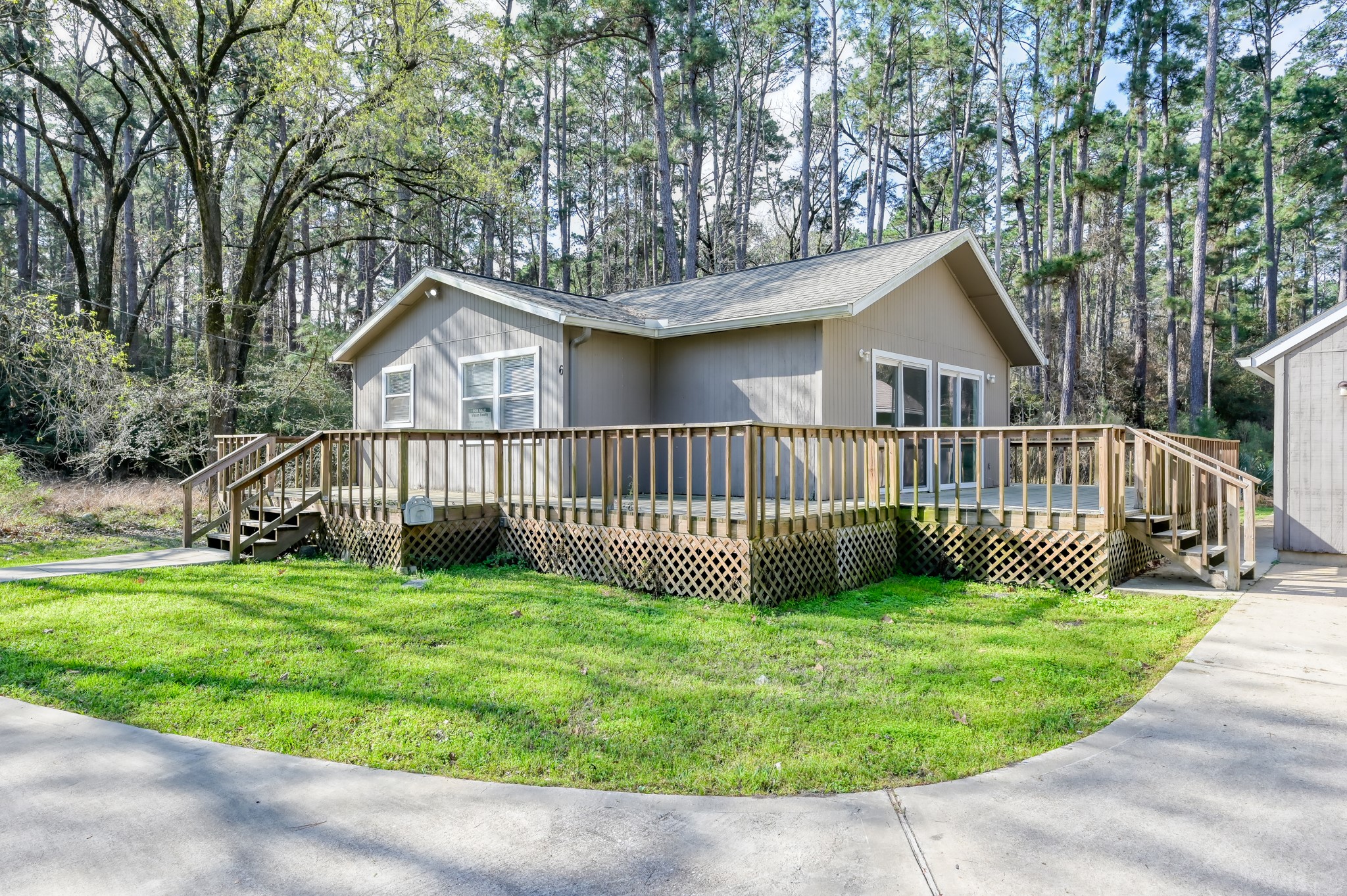 6 Hollow Forest Trinity, TX 75862 - Photo 2 of 38 a view of a house with a yard and deck