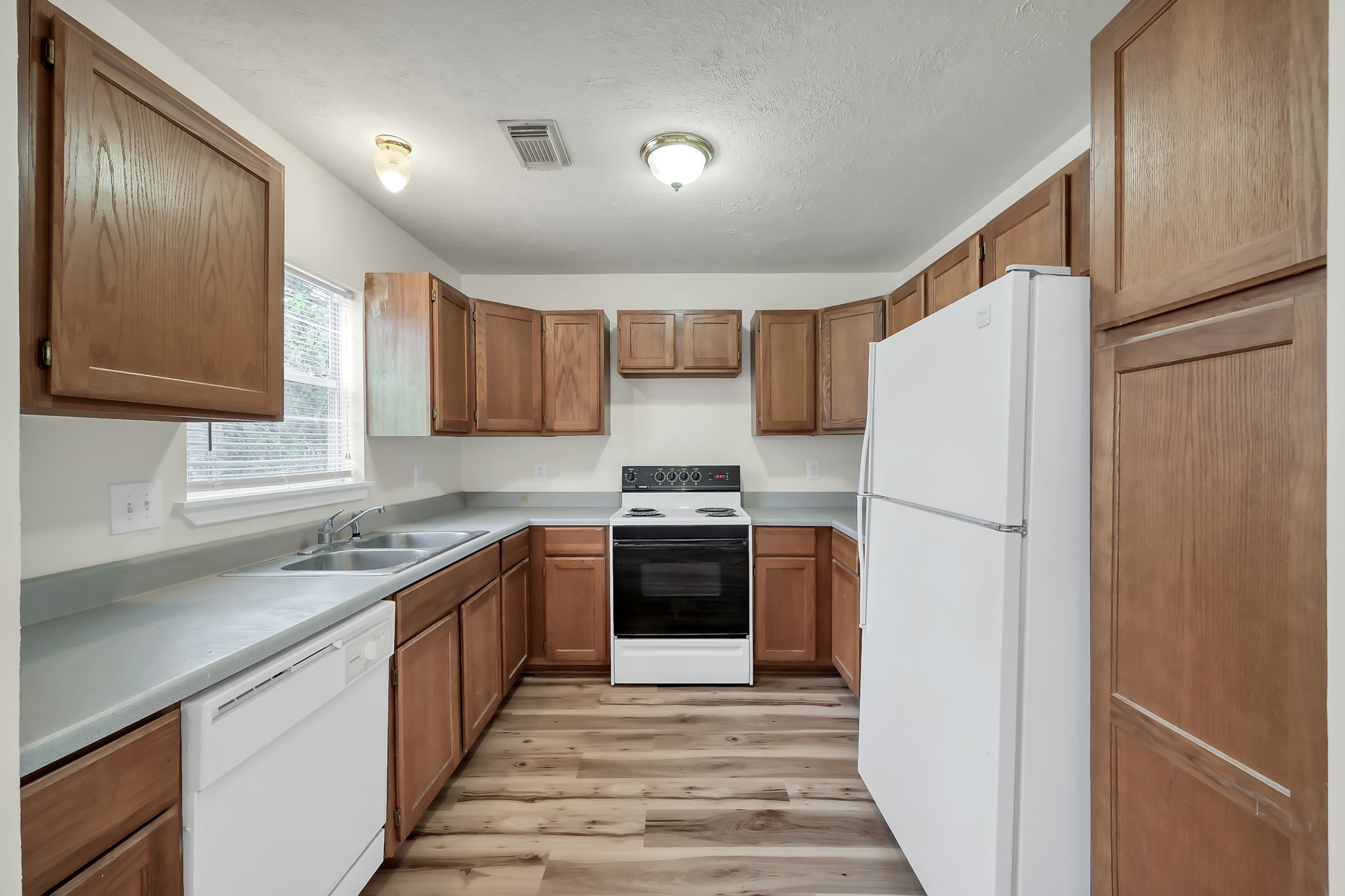 6 Hollow Forest Trinity, TX 75862 - Photo 23 of 38 a kitchen with stainless steel appliances a refrigerator sink and cabinets