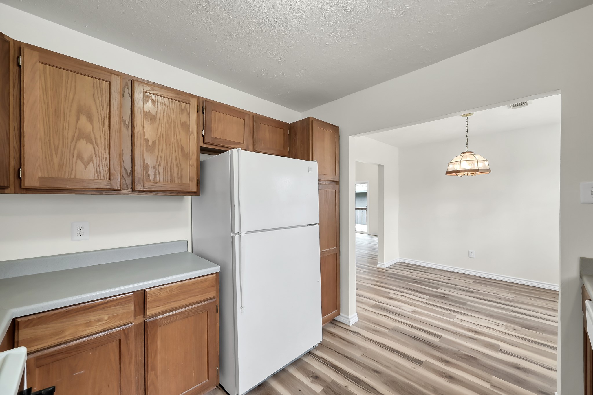 6 Hollow Forest Trinity, TX 75862 - Photo 25 of 38 a white refrigerator freezer sitting inside of a kitchen