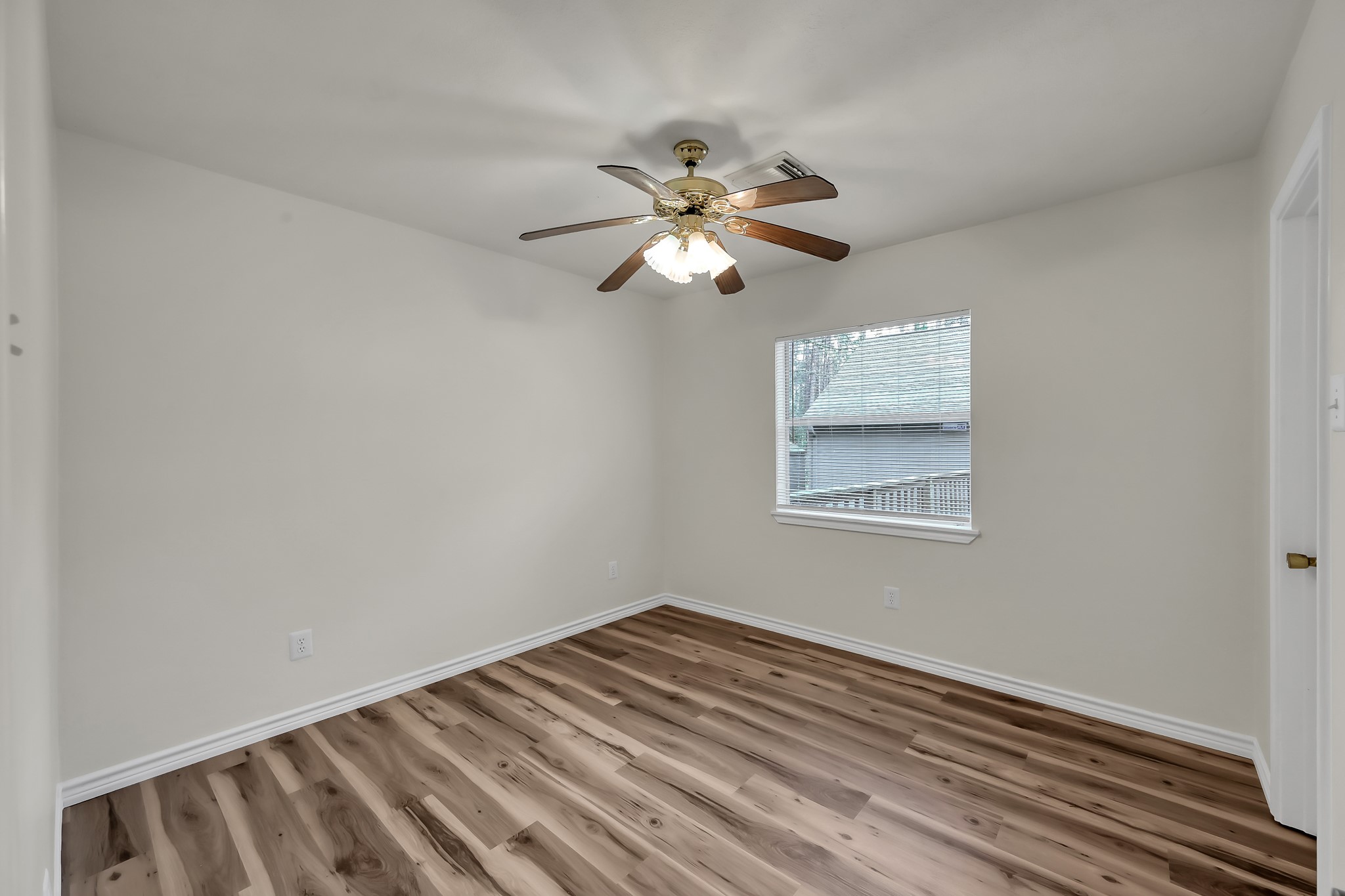 6 Hollow Forest Trinity, TX 75862 - Photo 30 of 38 a view of a room with a ceiling fan and wooden floor
