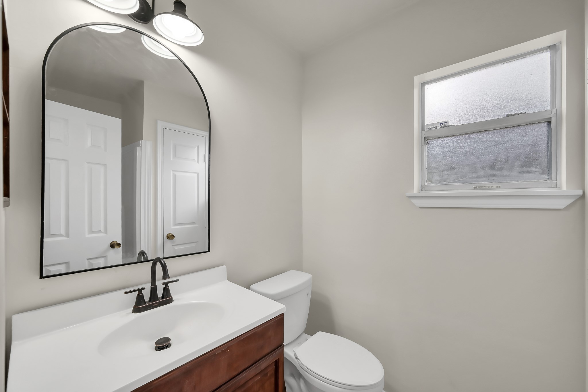 6 Hollow Forest Trinity, TX 75862 - Photo 37 of 38 a bathroom with a toilet sink and mirror