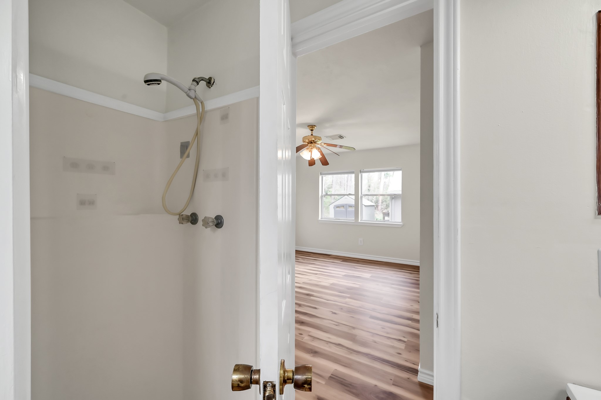 6 Hollow Forest Trinity, TX 75862 - Photo 38 of 38 a view of a hallway with wooden floor and a bathroom