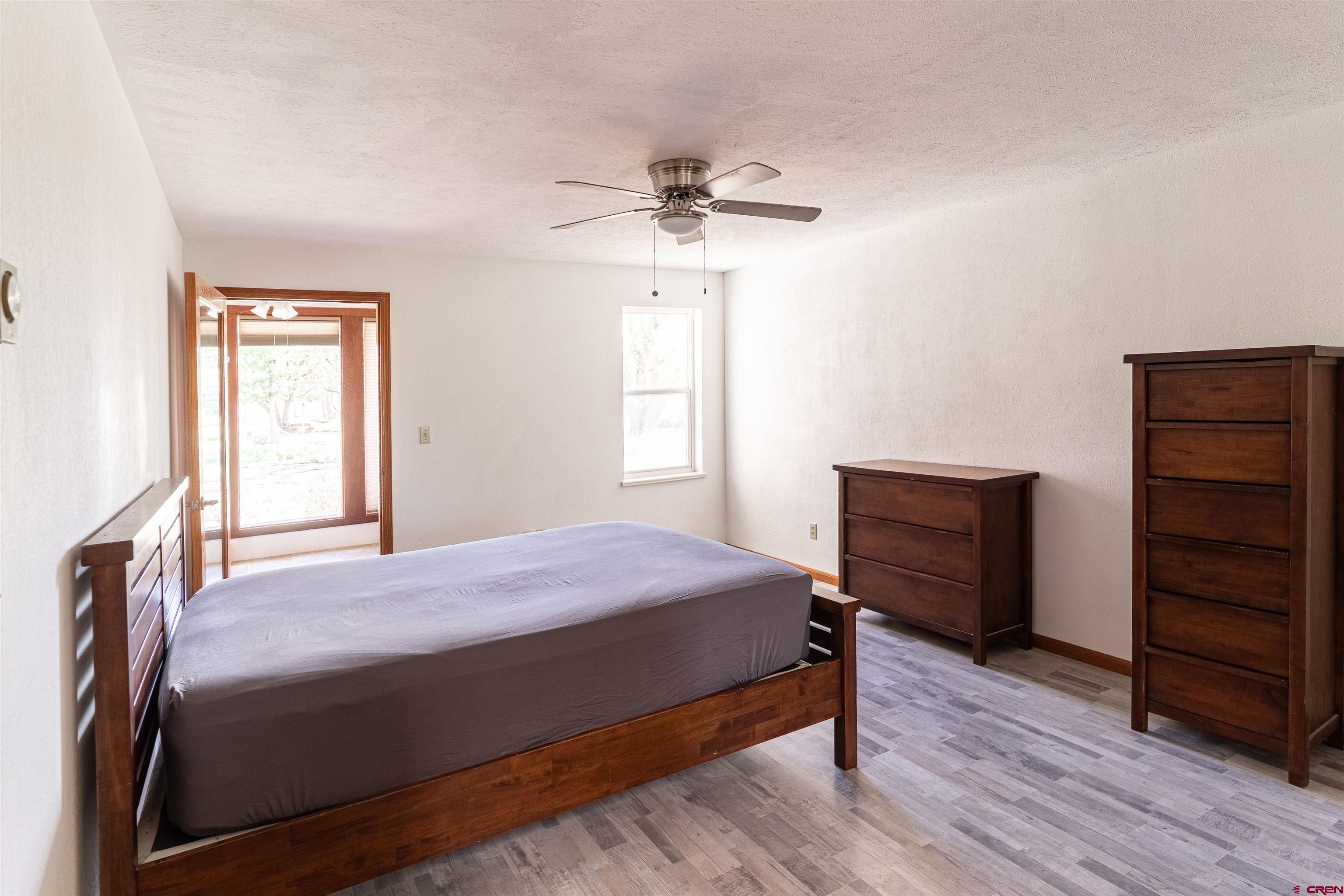 3754 2000th Road Delta, CO 81416 - Photo 25 of 35 a bedroom with a bed and a dresser
