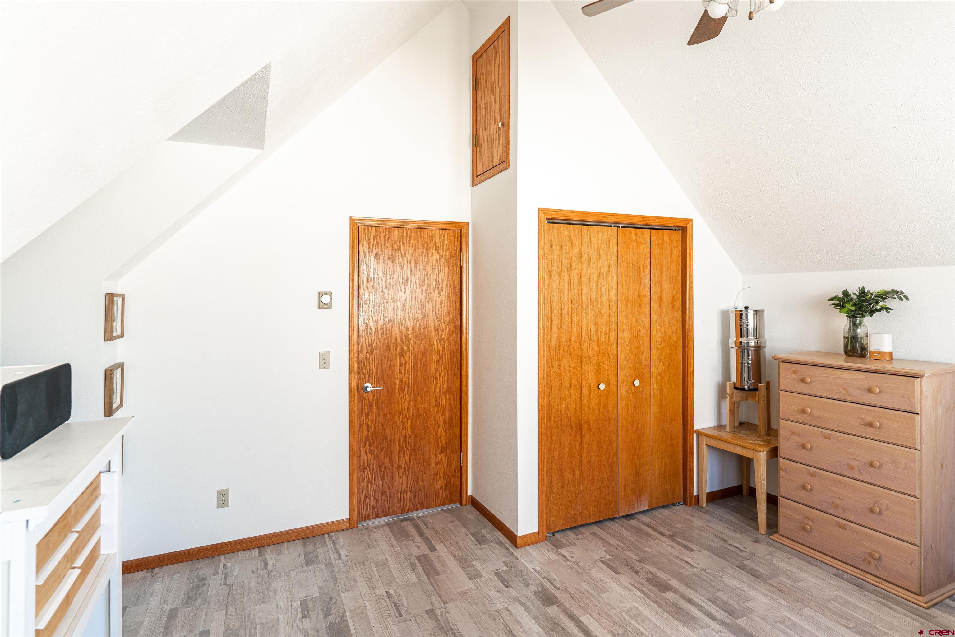 3754 2000th Road Delta, CO 81416 - Photo 28 of 35 a view of a hallway with wooden floor and closet