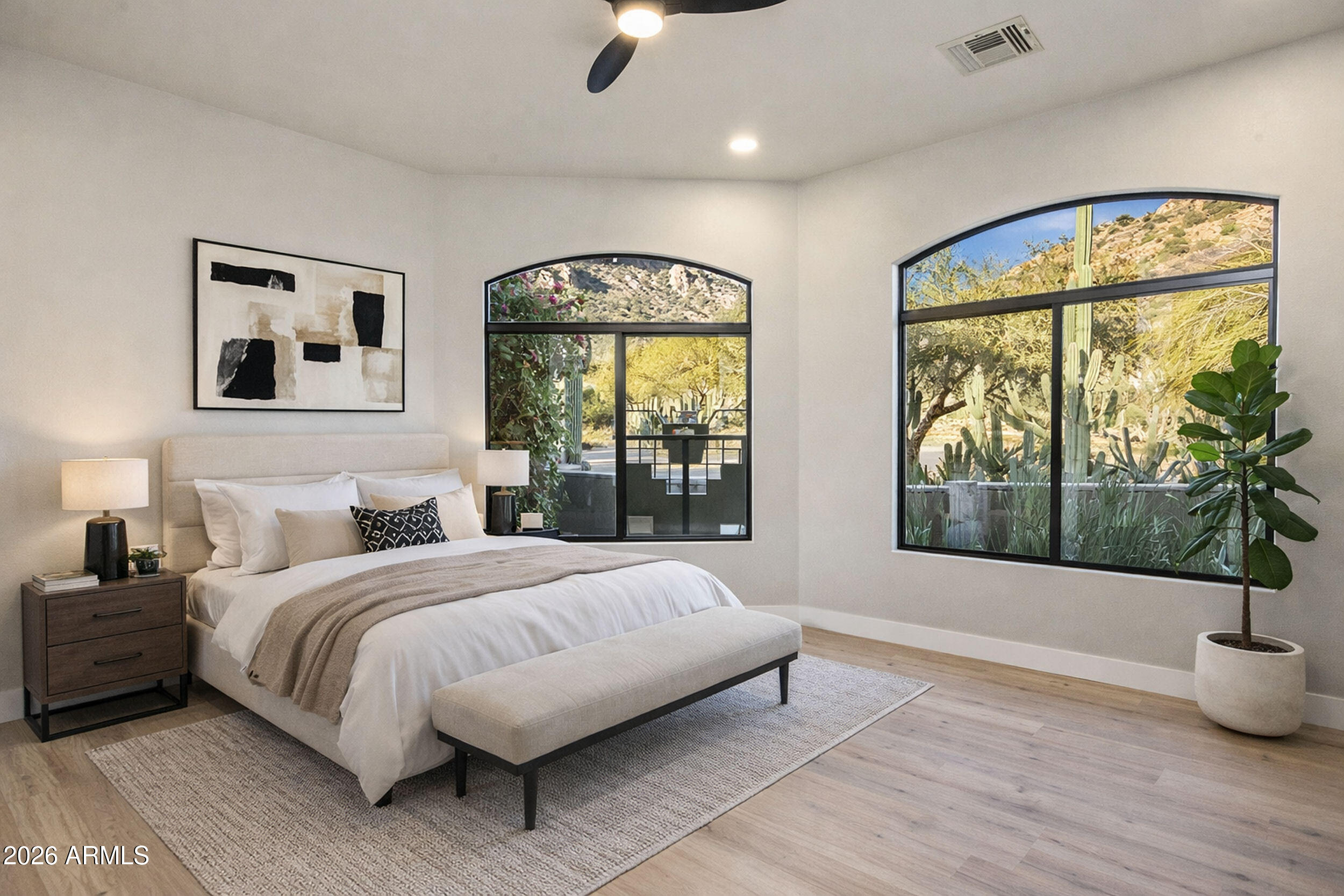 11083 East Juan Tabo Road Scottsdale, AZ 85255 - Photo 29 of 46 a bedroom with a large bed and a large window