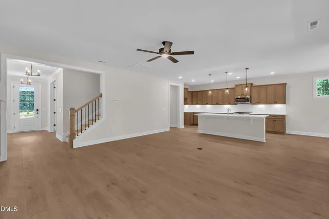 a view of a kitchen with a sink and a window
