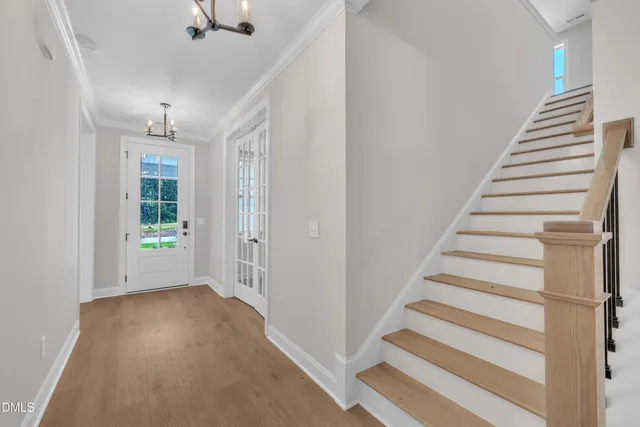 a view of entryway with stairs and wooden floor