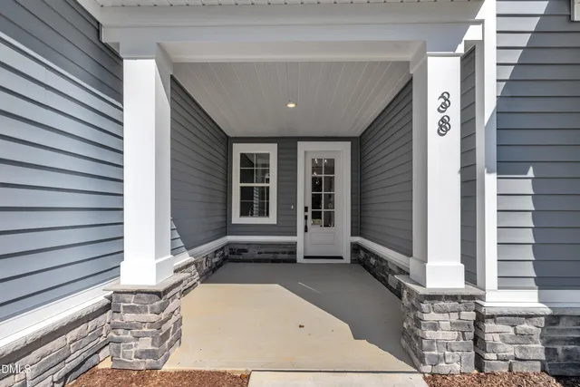 a view of a house with stairs and sitting area